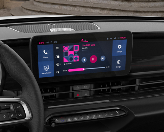 Das Bild zeigt den Innenraum eines Autos mit einem großen Infotainment-Bildschirm, der Musik und verschiedene Fahrzeugfunktionen anzeigt.